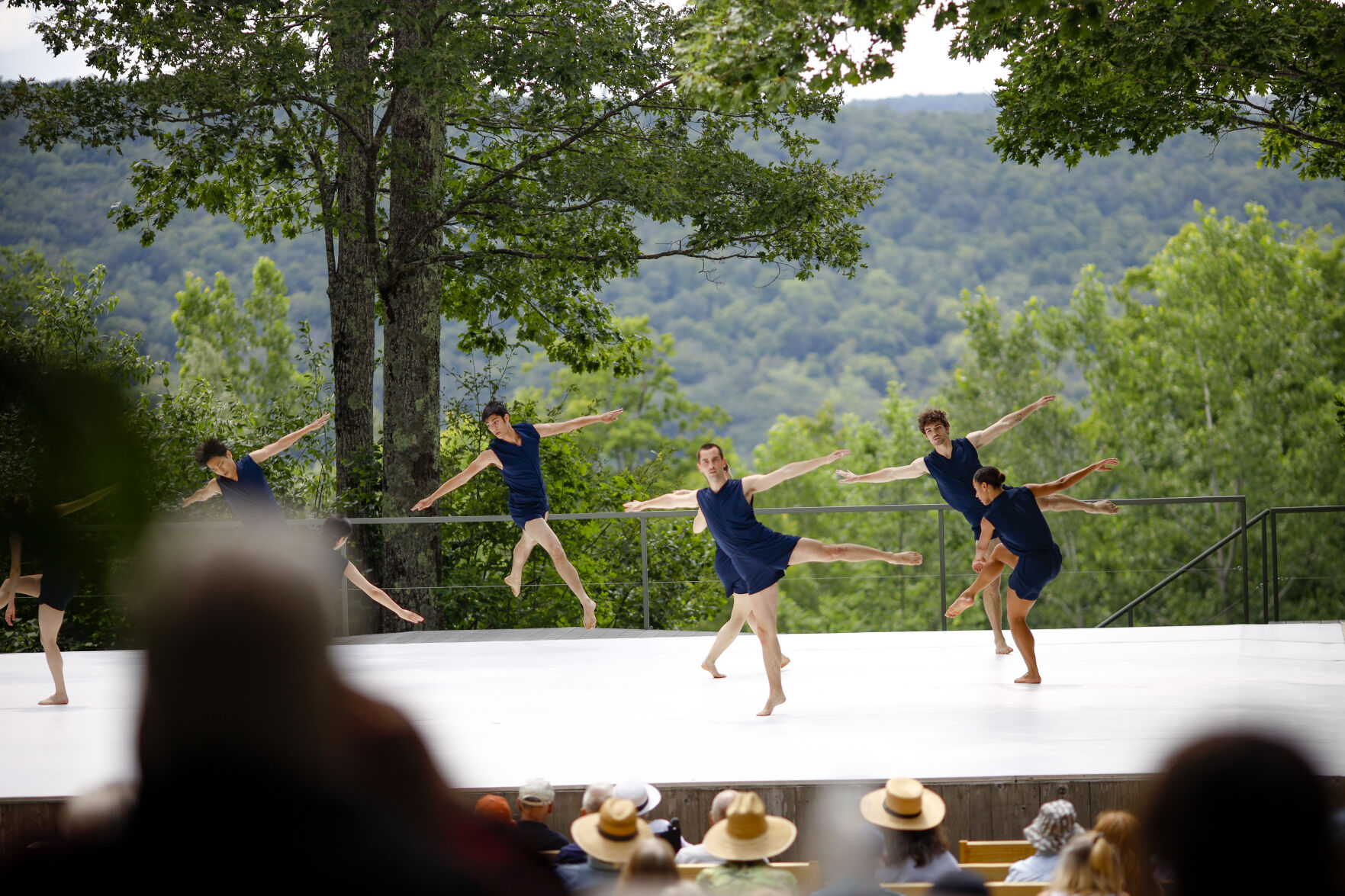 dancers perform on outdoor stage